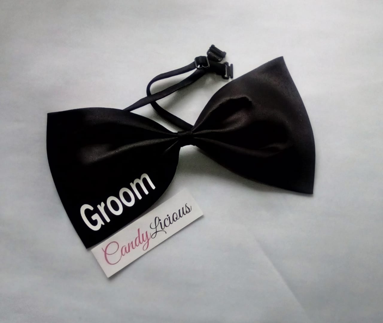 groom-bowtie--oversized--black-with-white-branding-